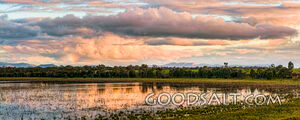 Spectacular sunset and reflection on surface of shallow lake.