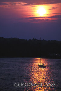 Boat sailing off into the sunset.