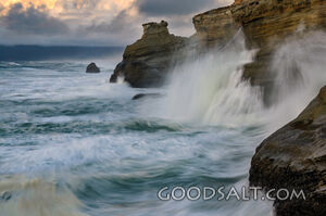 Waves Beating Against Sandstone Cliffs