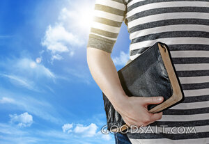 Woman Holding a Bible